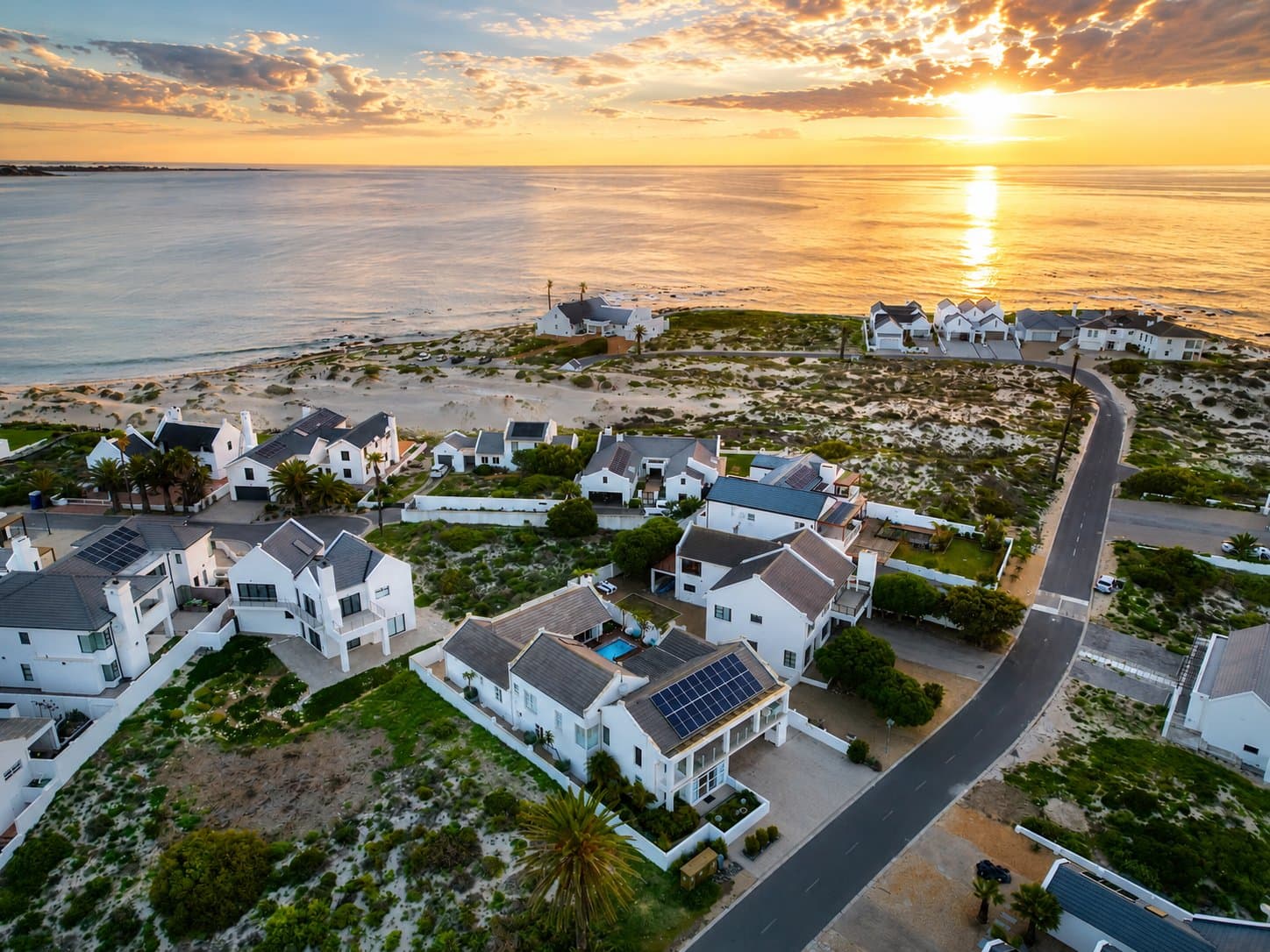Aerial view of Shelley Point Estate at sunset, looking out over the beach and the Atlantic