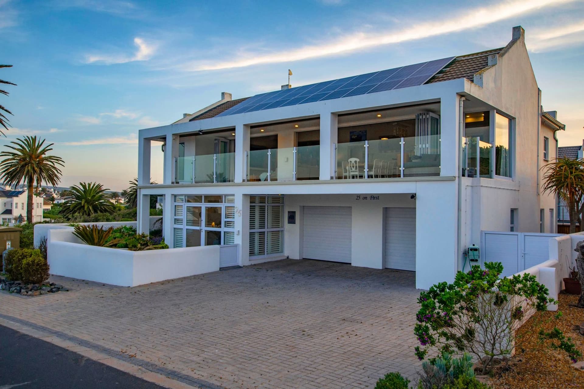 25 on First's angular white modernist facade seen from the street, Shelley Point Estate